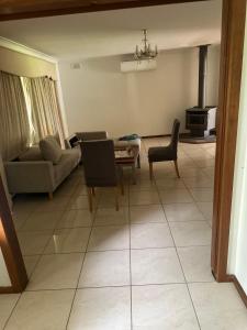 a living room with a couch and a table at 333 chalkhill rd McLaren vale 5171 in McLaren Vale
