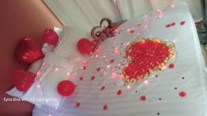 a cake with a heart on top of it at Country View Inn in Sungai Lembing