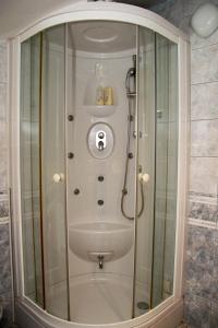 a shower with a glass enclosure in a bathroom at Hotel Villa Neretva - Metković in Metković