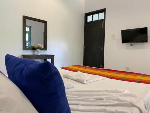 Postel nebo postele na pokoji v ubytování Nade Villas Ahungalla + 37 fotografií