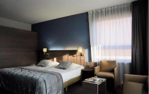 Postel nebo postele na pokoji v ubytování Casino Hotel