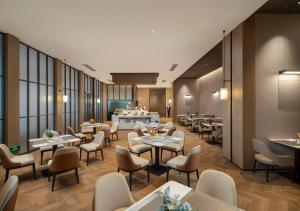 Posezení v ubytování Mehood Lestie International Hotel Panyu Wanbo Yuangang Metro Station Branch - Free Shuttle Bus to Canton Fair Complex During Canton Fair Period & Free afternoon tea & Free midnight snack & Free VPN Internet Access