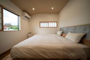 Postel nebo postele na pokoji v ubytování 御屋 荷 + 43 fotografií