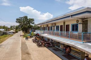 a group of motorcycles parked outside of a building at Diane Sunshine Villa Panglao near Beach in Panglao