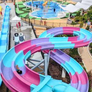 an aerial view of a water park with a water slide at Salty Sea Breeze Apartment 500m to waters edge in Gold Coast