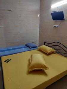 A bed or beds in a room at Xavier Guest House