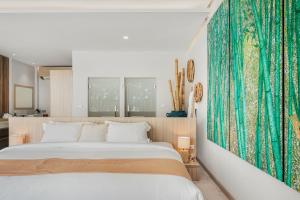 a bedroom with a bed and a large green rug at Beachfront Secret Tides Villa Tierra in Koh Samui  +44 photos