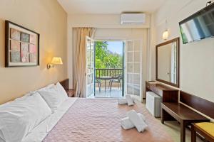 Postel nebo postele na pokoji v ubytování Fiori Hotel