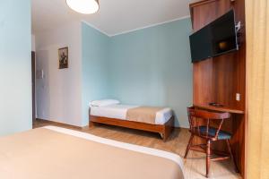 Postel nebo postele na pokoji v ubytování B&B Gusto West