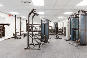 a gym with several treadmills and exercise machines at Ski Chalet C10 Levi Center incl 2 ski passes by Aavalevi in Levi