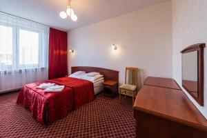 Säng eller sängar i ett rum på Hotel Wodnik