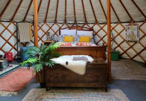 a bedroom with a bed in a yurt at Clachamish House in Portree