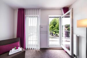 Postel nebo postele na pokoji v ubytování Fontane Hotel