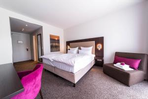 Postel nebo postele na pokoji v ubytování Fontane Hotel