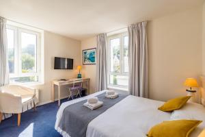 Postel nebo postele na pokoji v ubytování Hôtel Miléade de la Plage - Binic