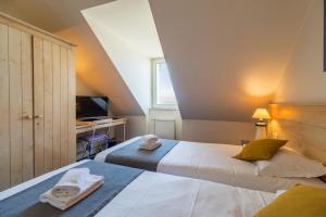 Postel nebo postele na pokoji v ubytování Hôtel Miléade de la Plage - Binic