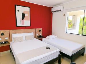 Postel nebo postele na pokoji v ubytování Rua Hoteles Talara