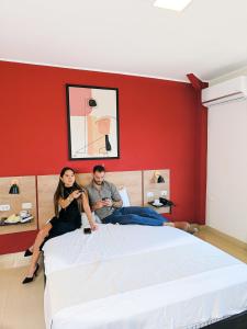Postel nebo postele na pokoji v ubytování Rua Hoteles Talara