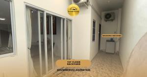 a hallway of a house with a sign that says first floor backyard at Bona H2A 5BR - Summer Veluxe in Batam Center +8 photos