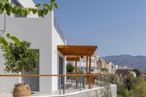 a balcony with a view of a building at South Akro in Míthoi +7 photos