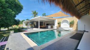 a villa with a swimming pool and a house at Villa Silana in Moalboal