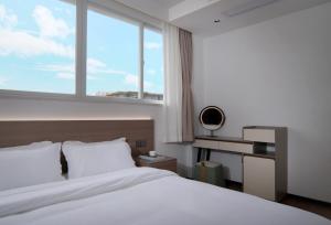 Llit o llits en una habitació de 贵客心宿 Xiamen Guike Xinsu