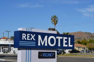 a sign for a motel on the side of a street at Rex Motel in Ventura