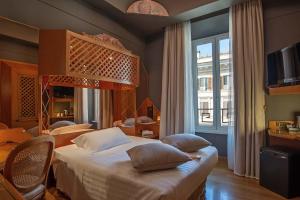 Postel nebo postele na pokoji v ubytování Hotel Isa