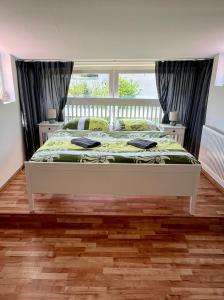 Postel nebo postele na pokoji v ubytování HARMONY Apartments