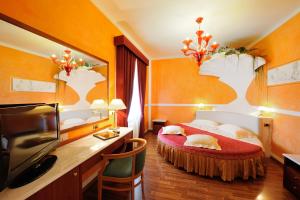 Postel nebo postele na pokoji v ubytování Hotel Benessere Villa Fiorita