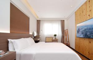 Llit o llits en una habitació de 贵客心宿 Xiamen Guike Xinsu