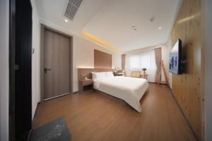 Llit o llits en una habitació de 贵客心宿 Xiamen Guike Xinsu