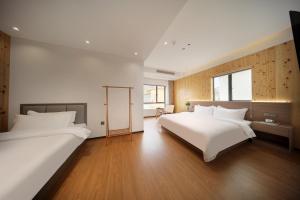 Llit o llits en una habitació de 贵客心宿 Xiamen Guike Xinsu