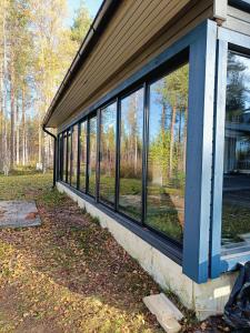 a row of windows on the side of a house at Chalet Pellonranta 2 in Mäkituoma