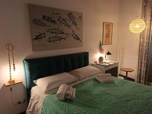 Кровать или кровати в номере We # Are ai Cassarelli