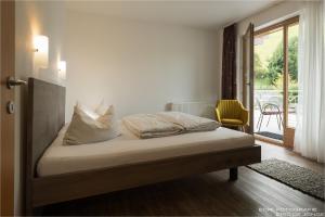 Posteľ alebo postele v izbe v ubytovaní Appartments Gerlos Am Bach - Riverside
