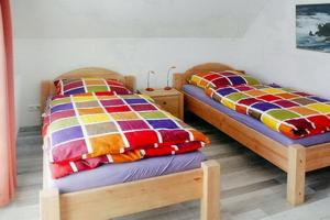 Ένα ή περισσότερα κρεβάτια σε δωμάτιο στο Ferienhaus Rügentraum