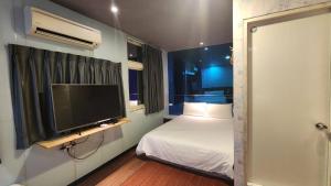 Voodi või voodid majutusasutuse Yung Feng Hotel toas
