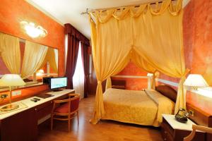 Postel nebo postele na pokoji v ubytování Hotel Benessere Villa Fiorita