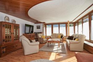 a living room filled with furniture and a tv at Haus Zeitz in Schönau am Königssee