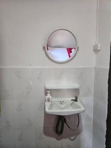 a bathroom with a sink and a mirror at Chitlatda Bila House in Luang Prabang +64 photos