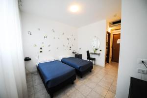 Posteľ alebo postele v izbe v ubytovaní Hp Fly Hotel Bologna