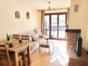 Μια τηλεόραση ή/και κέντρο ψυχαγωγίας στο Cómodo y Soleado apartamento en Panticosa