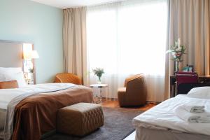 Postel nebo postele na pokoji v ubytování Clarion Hotel Arlanda Airport Terminal