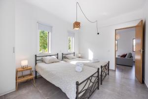 Ένα ή περισσότερα κρεβάτια σε δωμάτιο στο Yucca Garden Villas +46 φωτογραφίες
