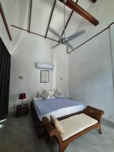 a bedroom with a bed with a bench in it at 3 Bedroom Beautiful and Private Sunset Sea Views Villa Mango SDV153-By Samui Dream Villas in Bophut  +60 photos