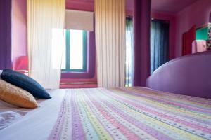 Postel nebo postele na pokoji v ubytování Hotel Alma de Romero