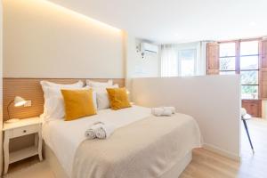Posteľ alebo postele v izbe v ubytovaní Santa Brigida Window Suite