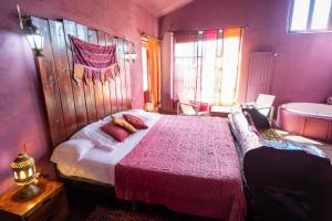 Postel nebo postele na pokoji v ubytování Hotel Alma de Romero