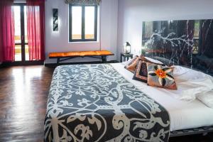 Postel nebo postele na pokoji v ubytování Hotel Alma de Romero